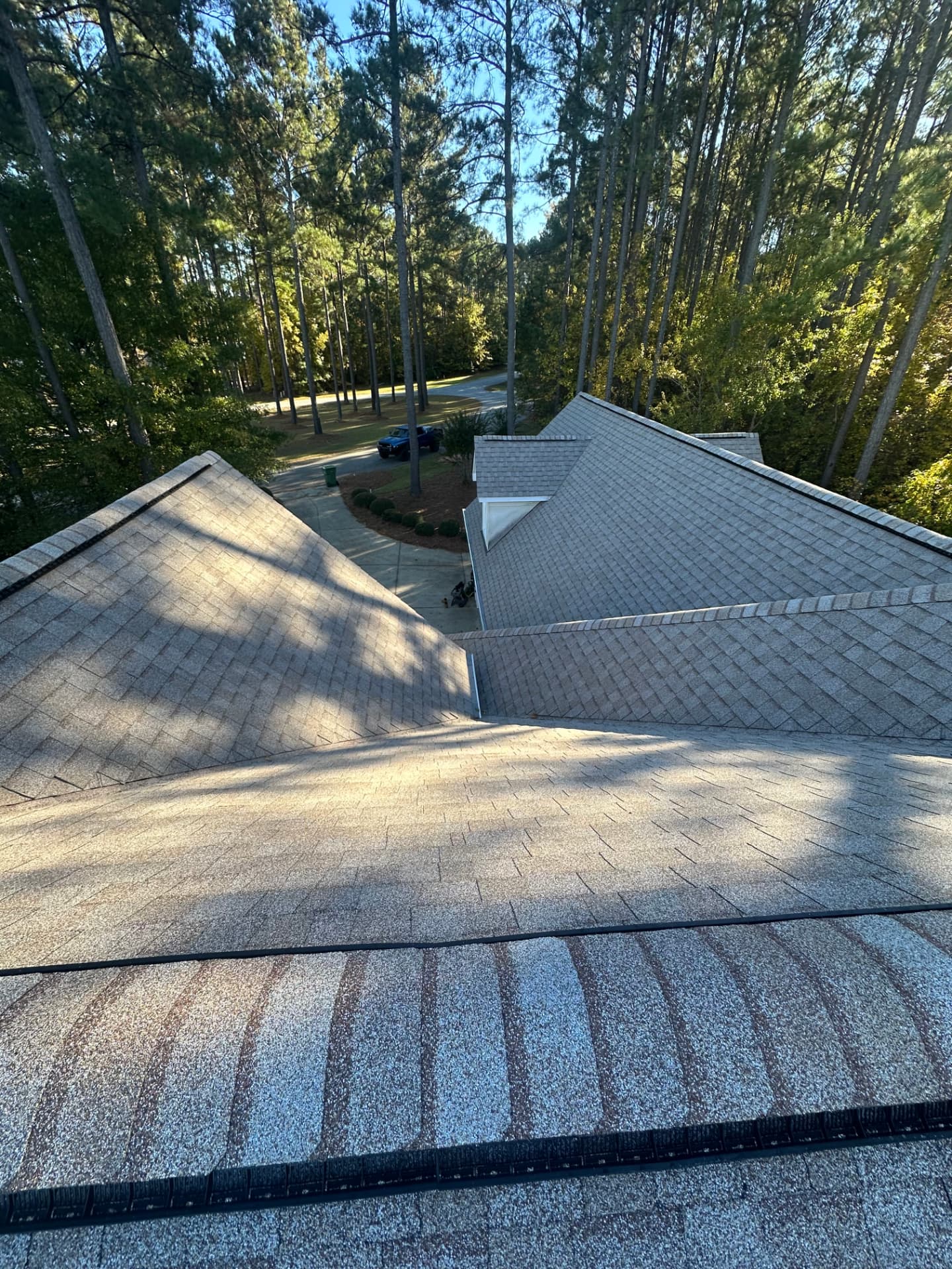 Multi-gable home with a new driftwood colored architectural shingle roof installed by Coster Roofing Co in Clinton SC