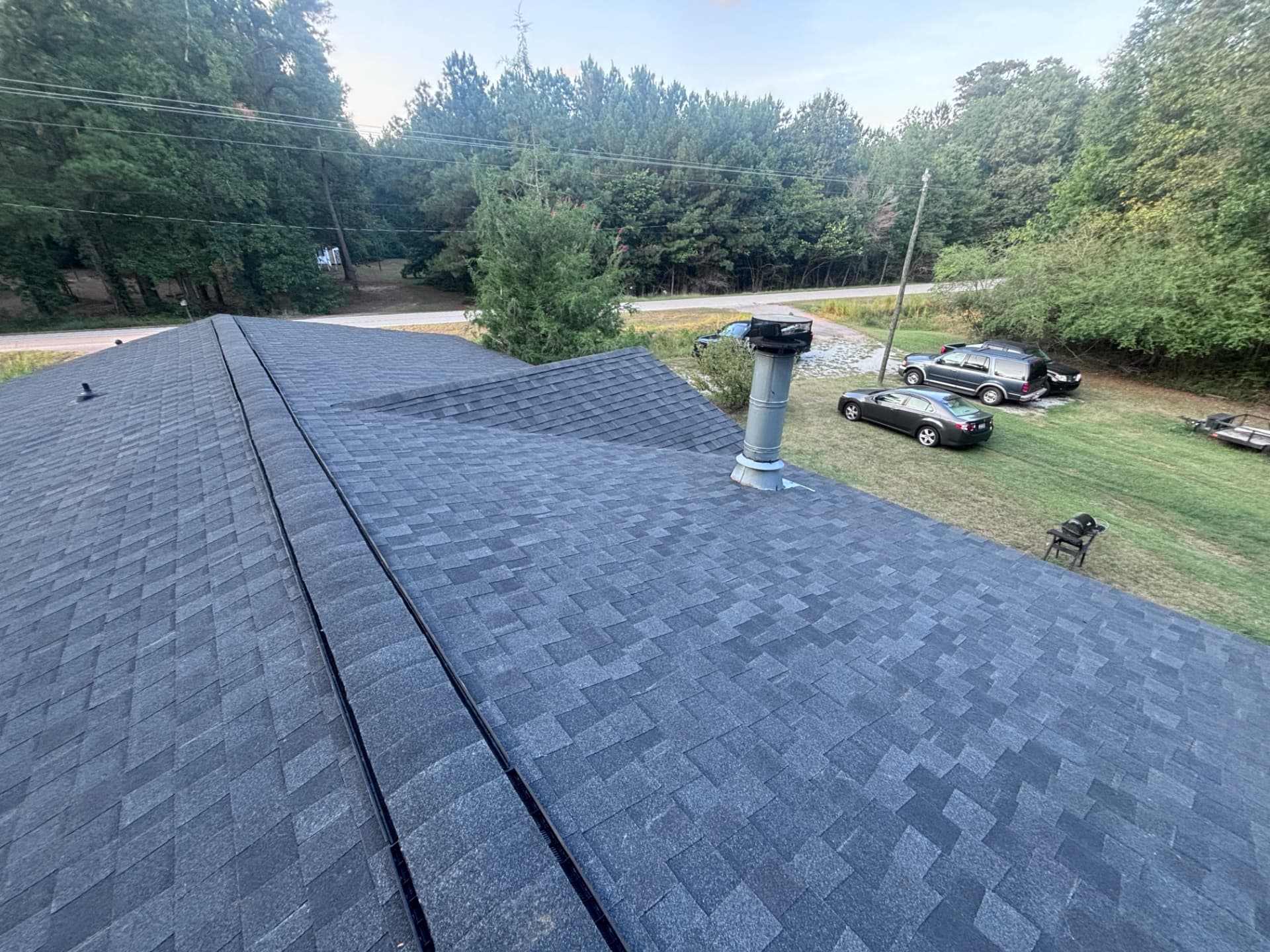 New gray architectural shingle roof with ridge vent detail in McCormick SC by Coster Roofing Co
