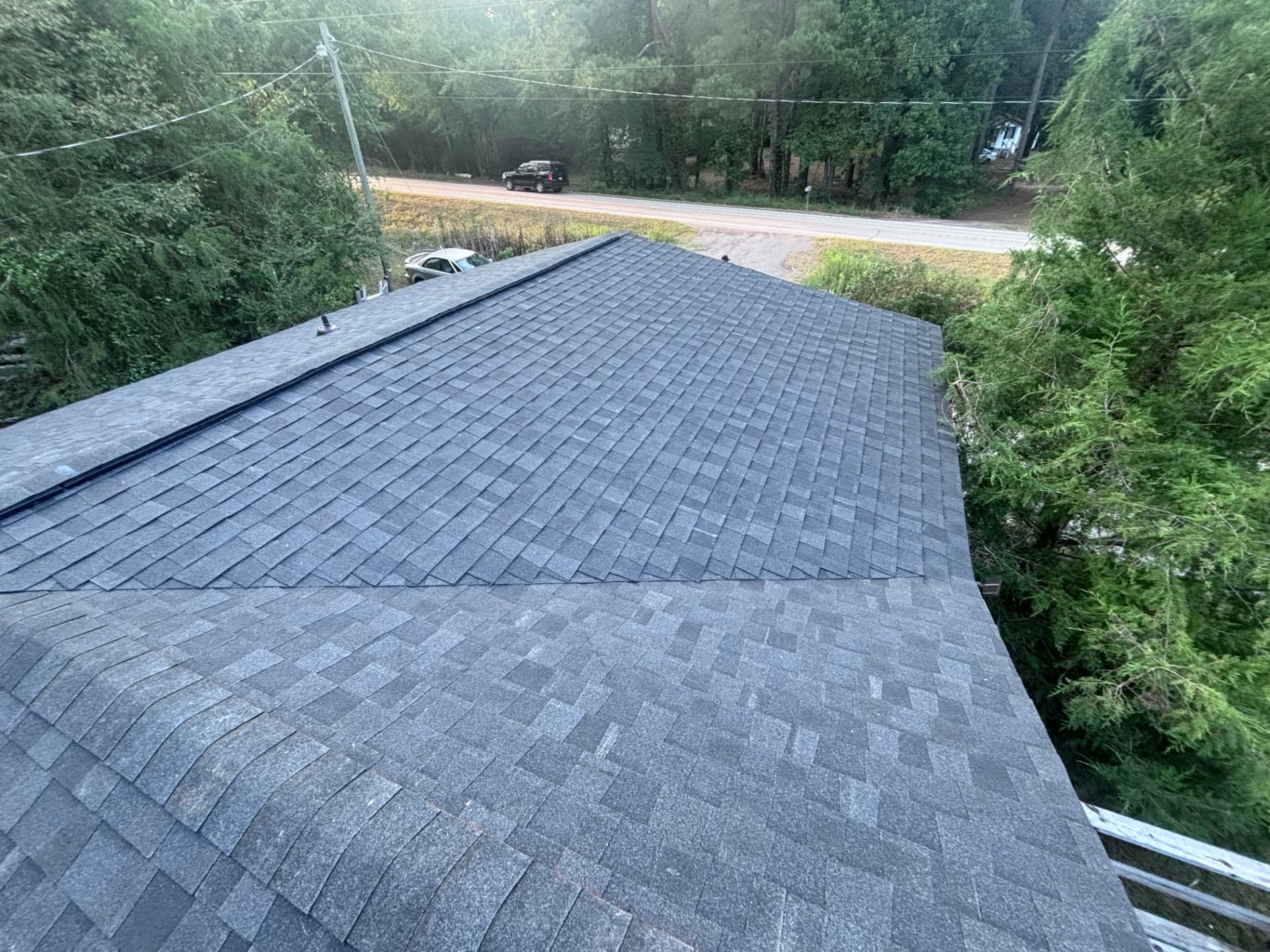 Finished gray architectural shingle hip roof on a Newberry County SC home by Coster Roofing Co